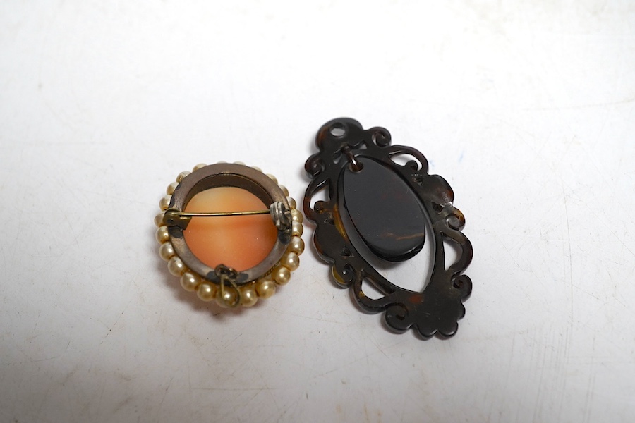 A yellow metal shell cameo ring, a brooch and a pendant. Condition - fair